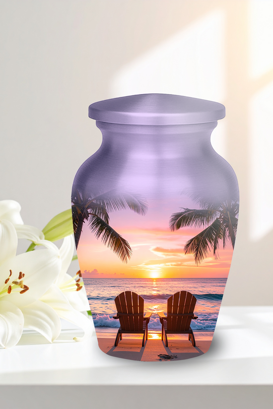 Vibrant ocean sunset graphic on a tropical beach cremation urn, showing warm colors and calm waves