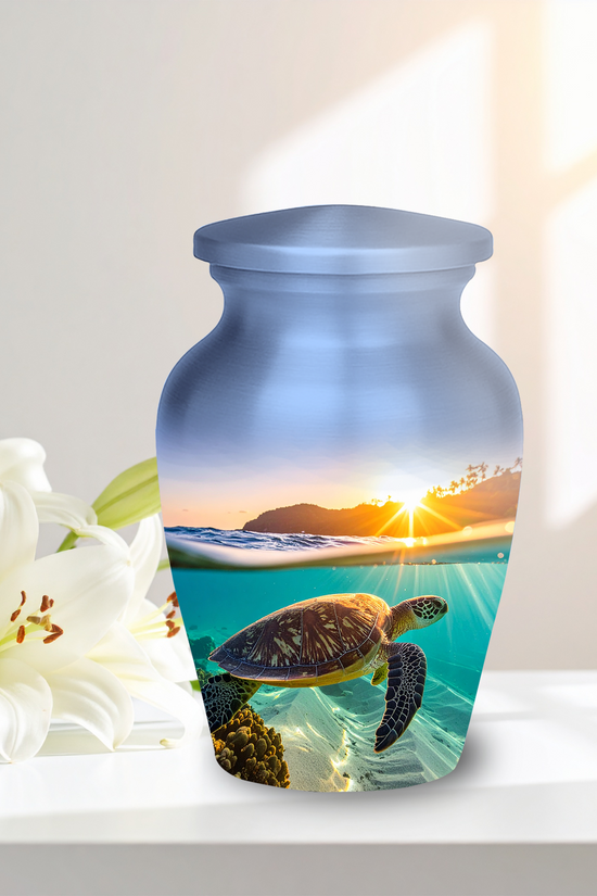 sea turtle swimming gracefully underwater in clear turquoise water, on a cremation urn